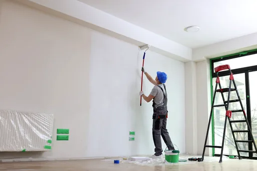 Painter rolling a clean white gallery wall near Bergamot Station in Santa Monica